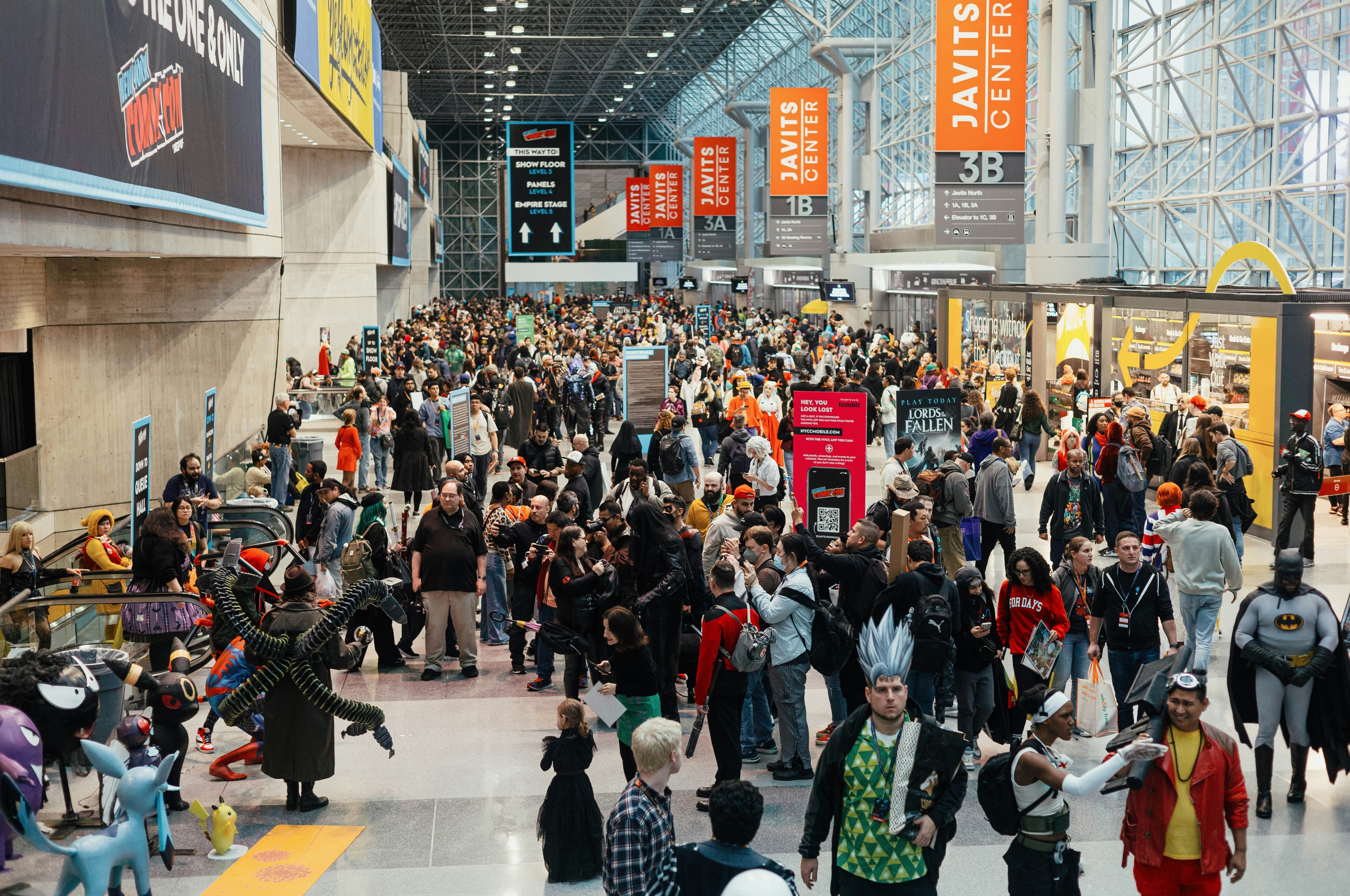 Fan convention floor with costumed attendees