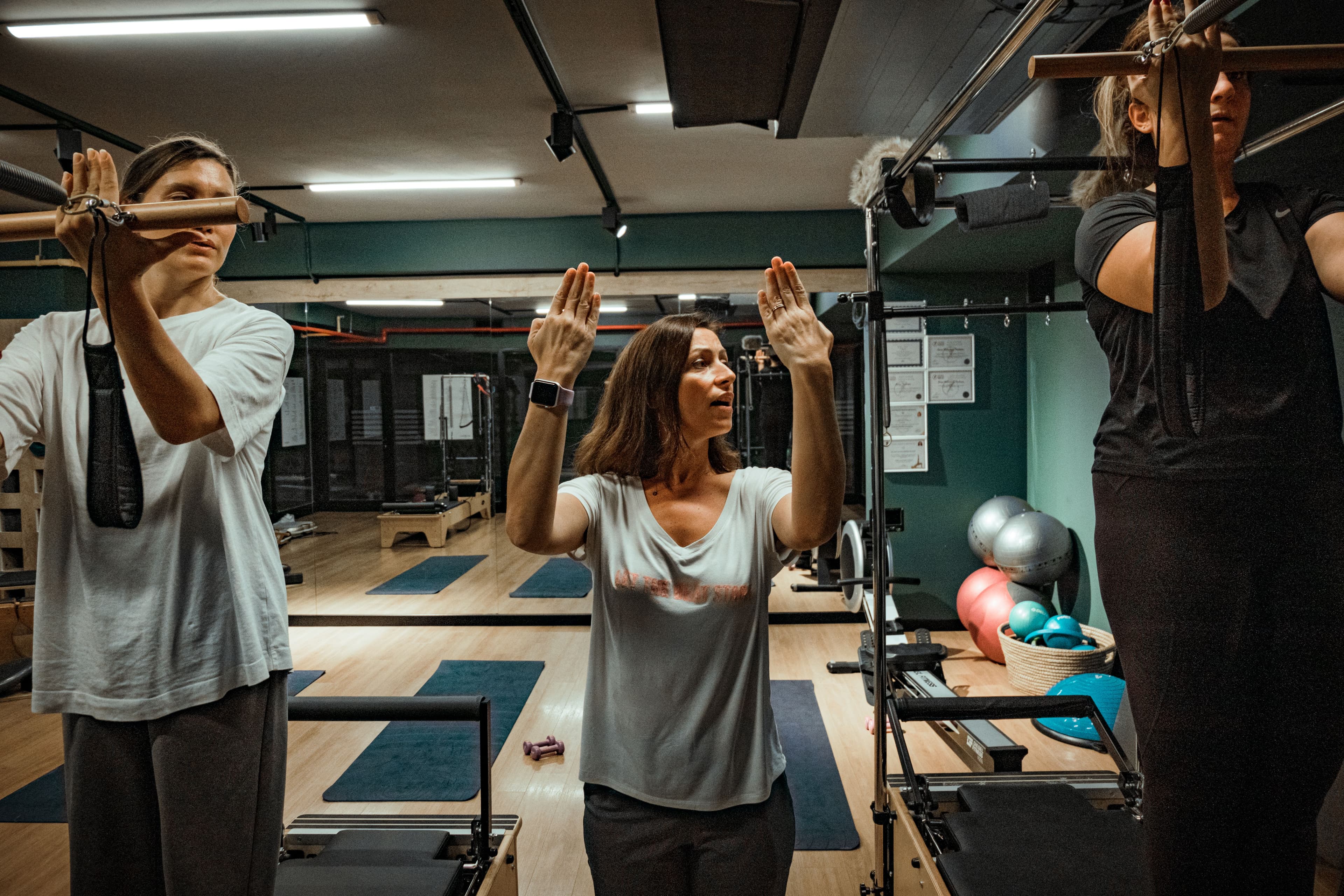 Fitness studio class with instructor and group