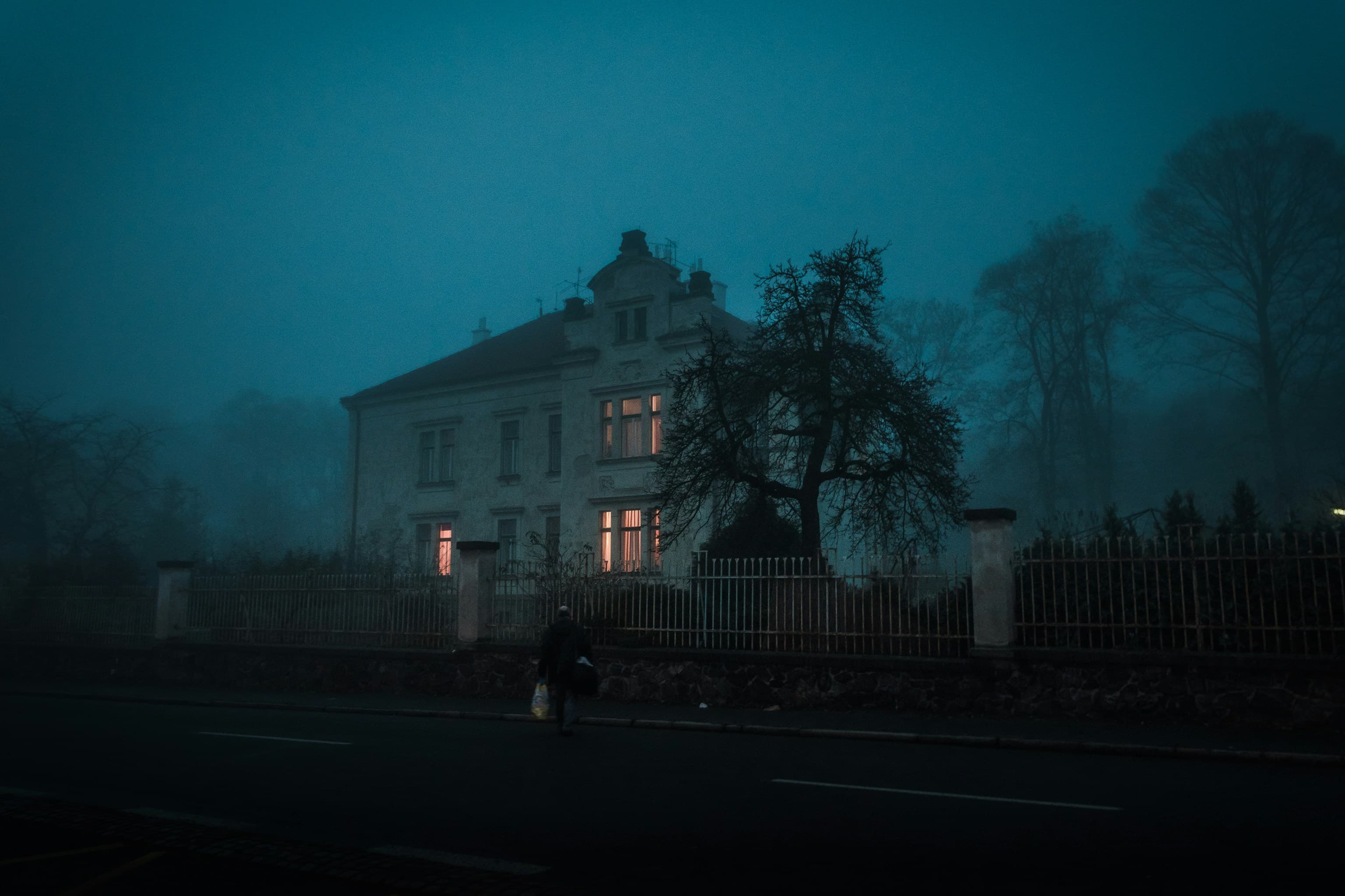 Haunted house entrance with fog and eerie lighting