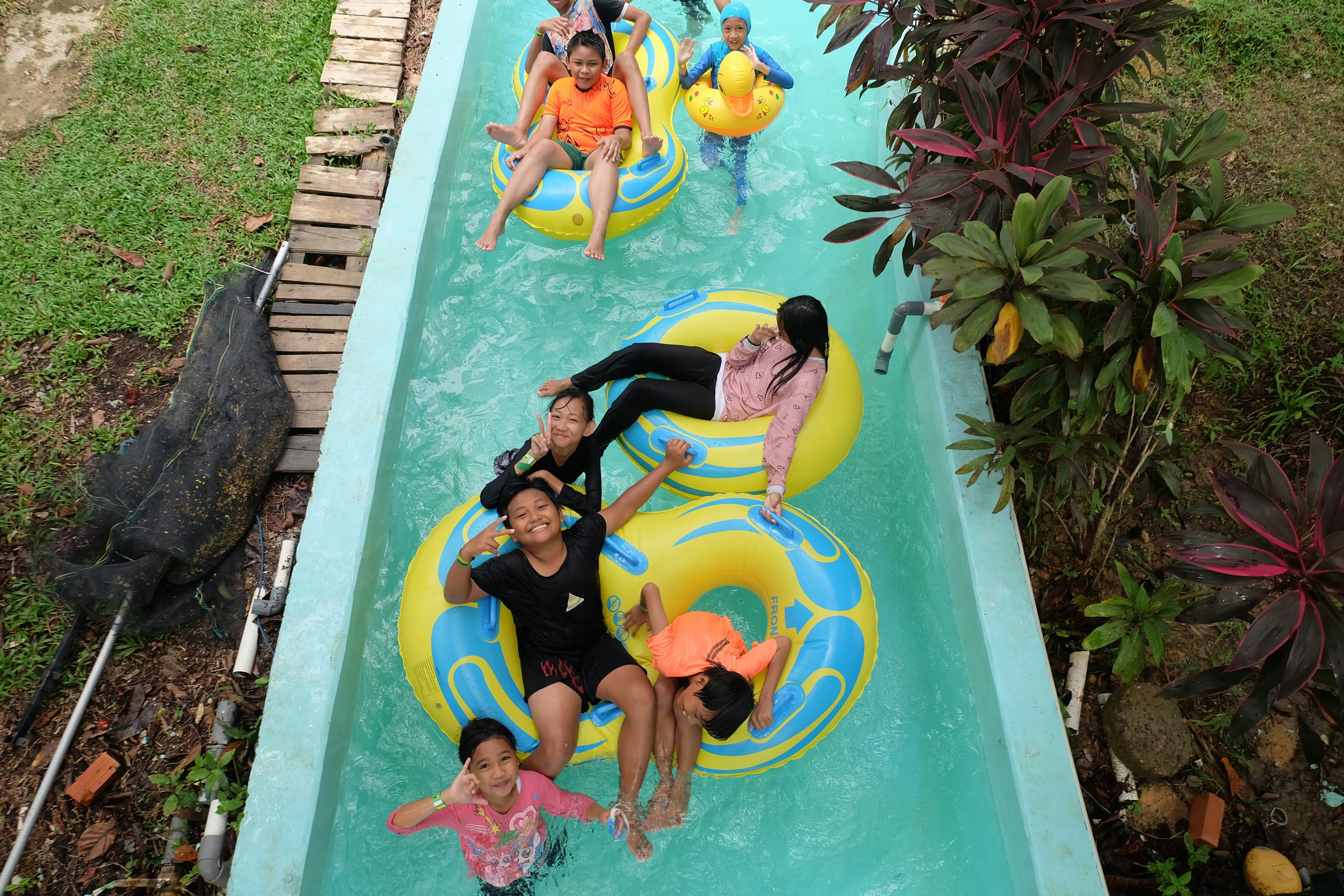Waterpark with colorful slides and outdoor pool on a sunny day